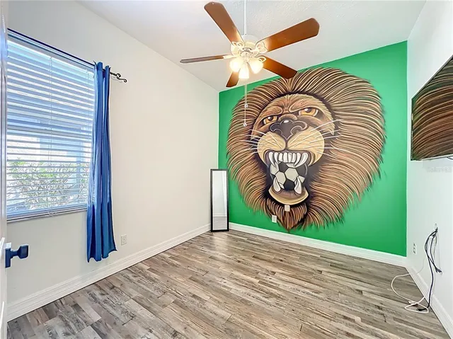 a view of a livingroom with furniture and a window