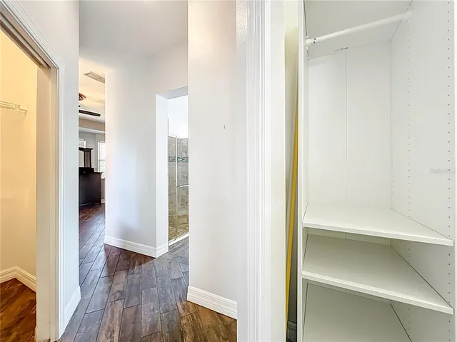 a view of an empty walk in closet