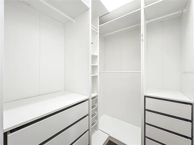 a bathroom with a sink and vanity