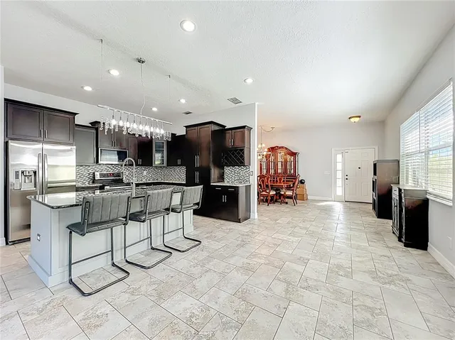 a kitchen with a sink and a stove top oven