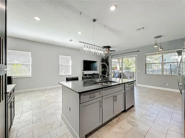a view of a kitchen with furniture and a flat screen tv