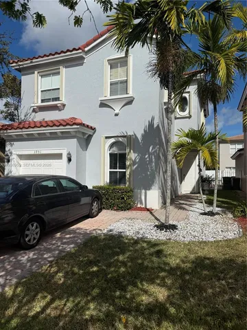 a car parked in front of a house