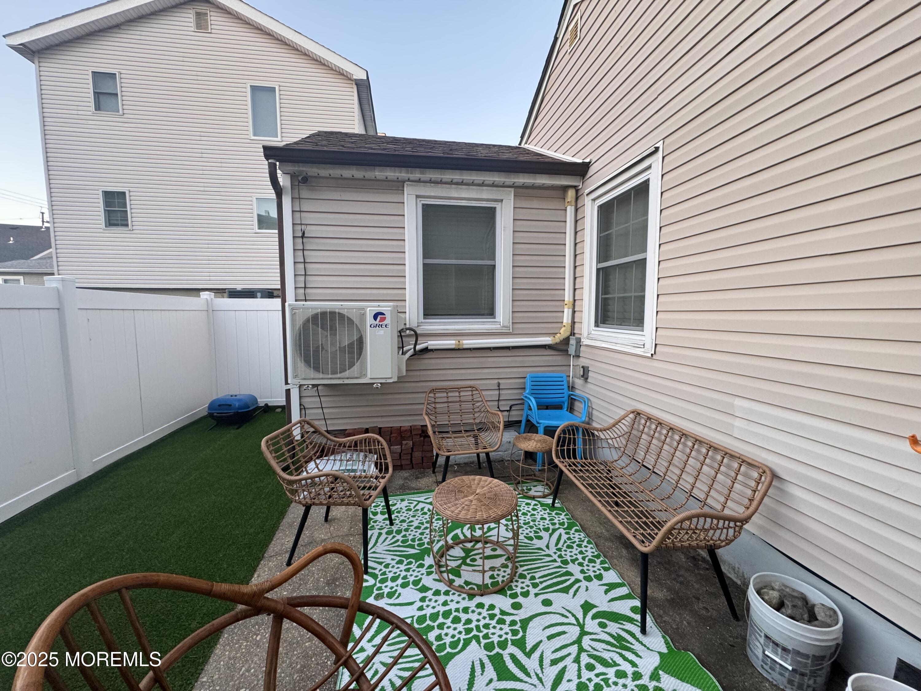 124 Lincoln Avenue, Unit 4 Seaside Heights, NJ 08751 - Photo 13 of 14 a balcony with table and chairs