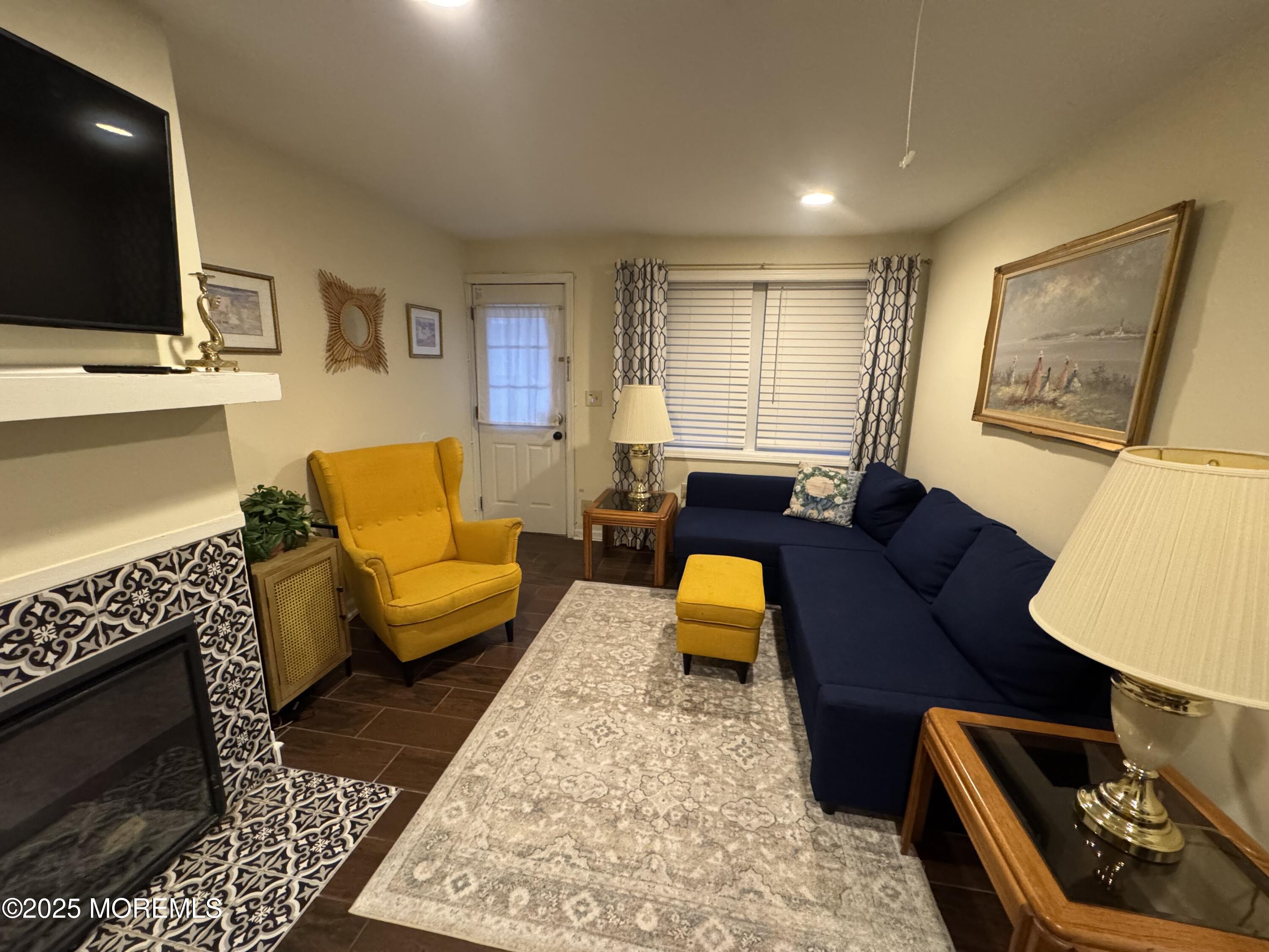 124 Lincoln Avenue, Unit 4 Seaside Heights, NJ 08751 - Photo 6 of 14 a living room with furniture and a flat screen tv