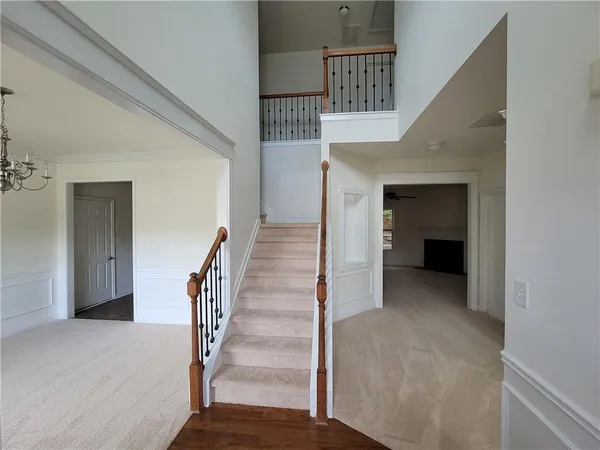 a view of entryway and hall with wooden floor
