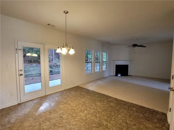 a view of a kitchen with a sink and a fireplace