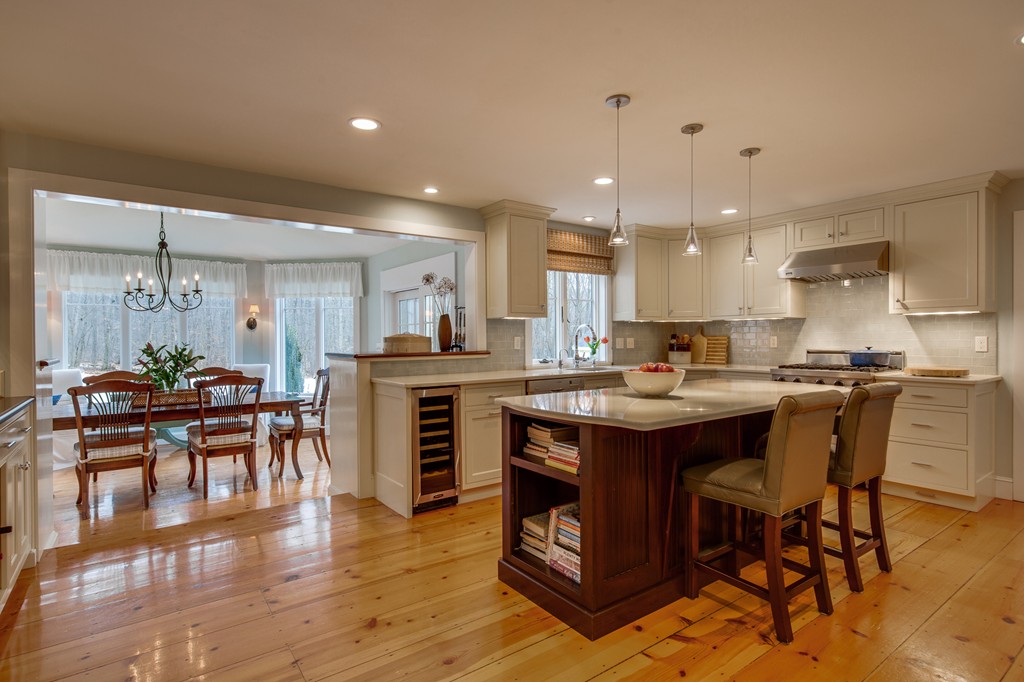 42 Oak Hill Road Harvard, MA 01451 - Photo 11 of 30 a kitchen with stainless steel appliances granite countertop a table chairs sink and cabinets