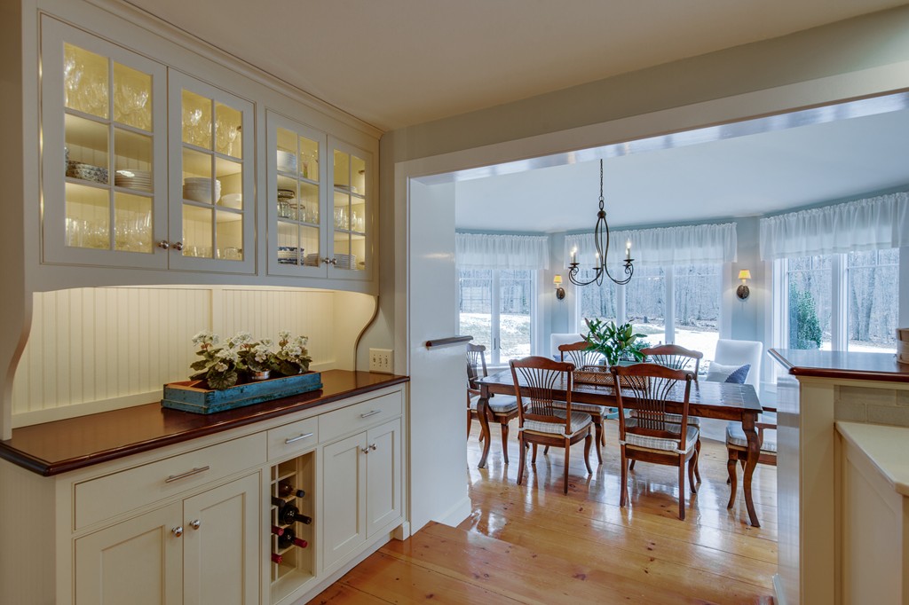 42 Oak Hill Road Harvard, MA 01451 - Photo 15 of 30 a kitchen with granite countertop a table and chairs in it
