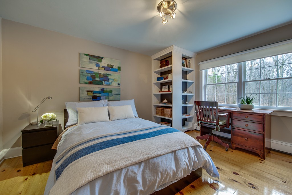 42 Oak Hill Road Harvard, MA 01451 - Photo 24 of 30 a bedroom with a bed and a bookshelf