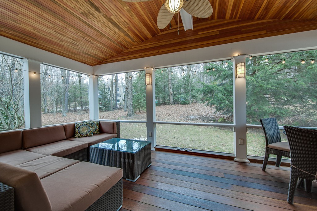 42 Oak Hill Road Harvard, MA 01451 - Photo 6 of 30 a living room with furniture and a floor to ceiling window