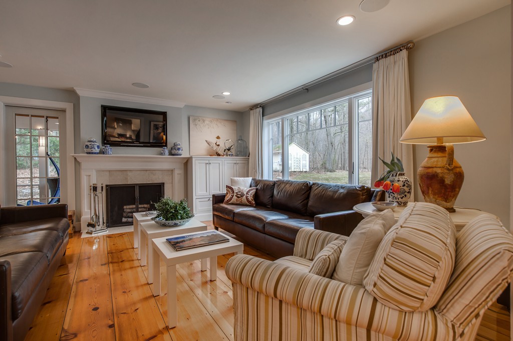 42 Oak Hill Road Harvard, MA 01451 - Photo 10 of 30 a living room with furniture fireplace and a flat screen tv