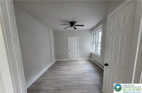 a view of an empty room with a window