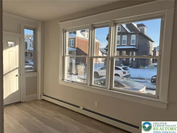 wooden floor and a window in a room
