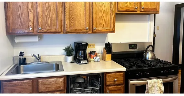 a kitchen with a sink and cabinets