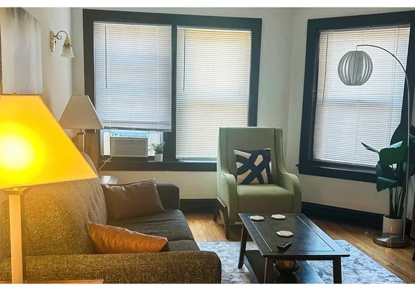 a living room with furniture and a window