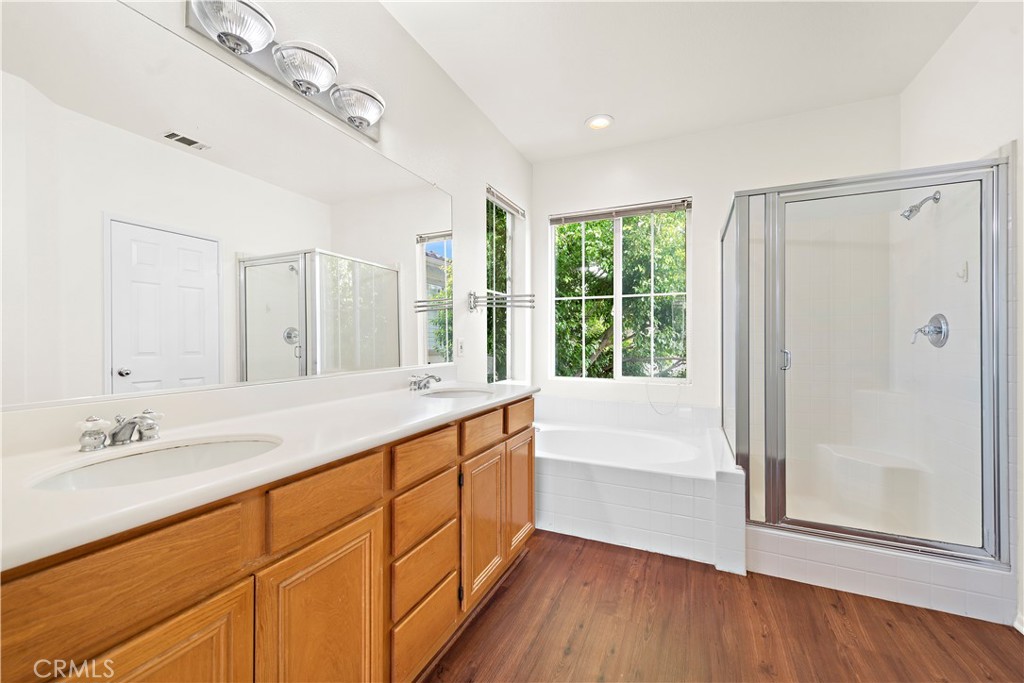 68 Kyle Court Ladera Ranch, CA 92694 - Photo 13 of 25 a bathroom with a granite countertop sink mirror and a bathtub