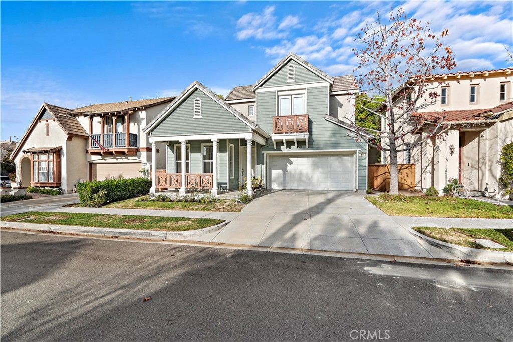68 Kyle Court Ladera Ranch, CA 92694 - Photo 18 of 25 a front view of a house with a yard and garage