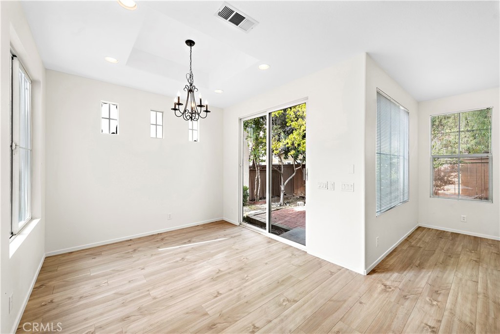 68 Kyle Court Ladera Ranch, CA 92694 - Photo 6 of 25 a view of a room with wooden floor and entryway