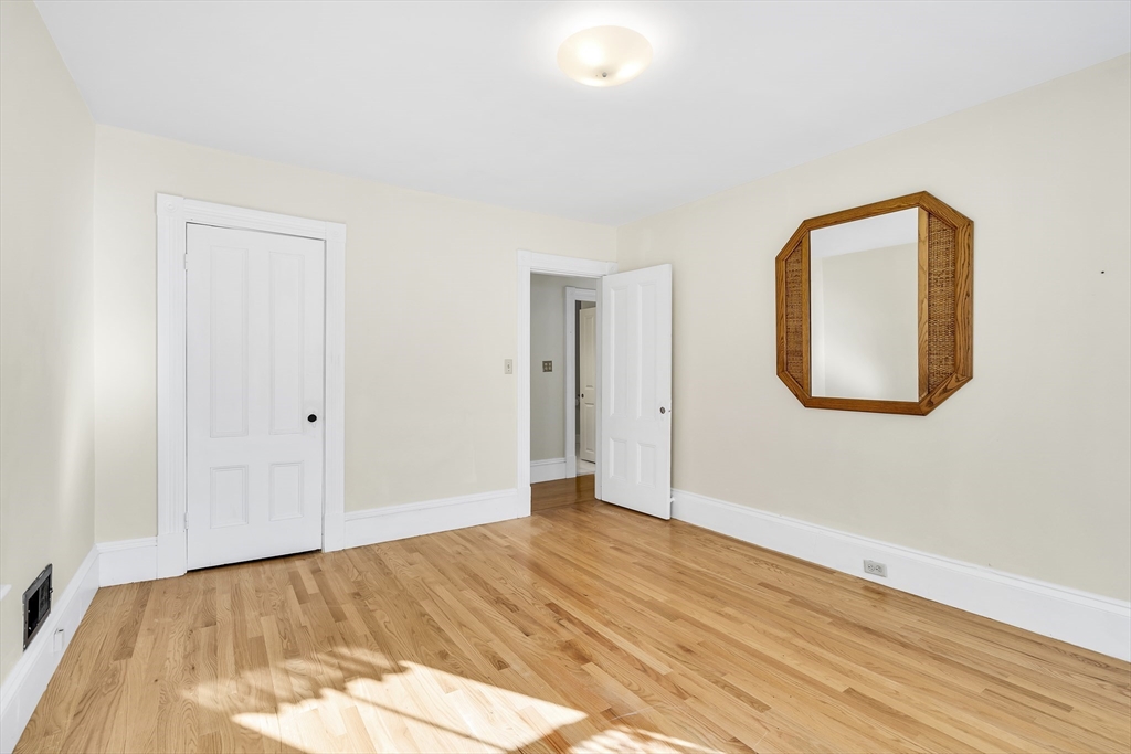 16 County Street Foxboro, MA 02035 - Photo 14 of 33 a view of an empty room and wooden floor