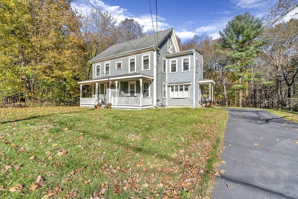 16 County Street Foxboro, MA 02035 - Photo 2 of 33 a front view of a building with a garden