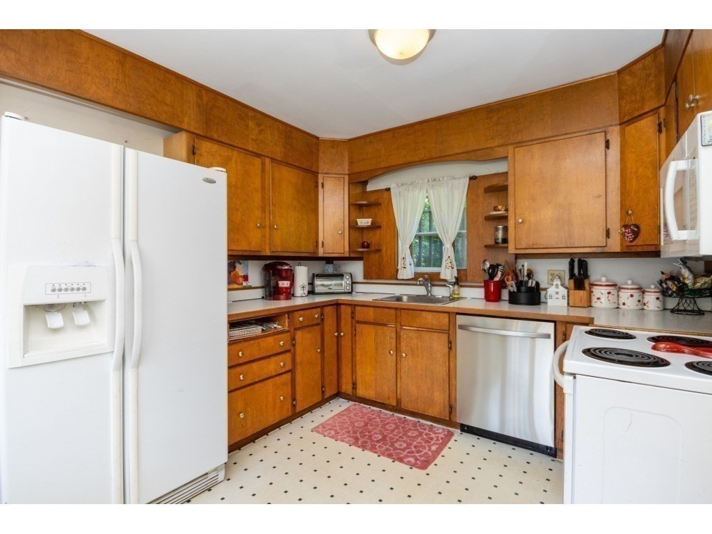 16 County Street Foxboro, MA 02035 - Photo 24 of 33 a kitchen with stainless steel appliances granite countertop a refrigerator a stove and a sink
