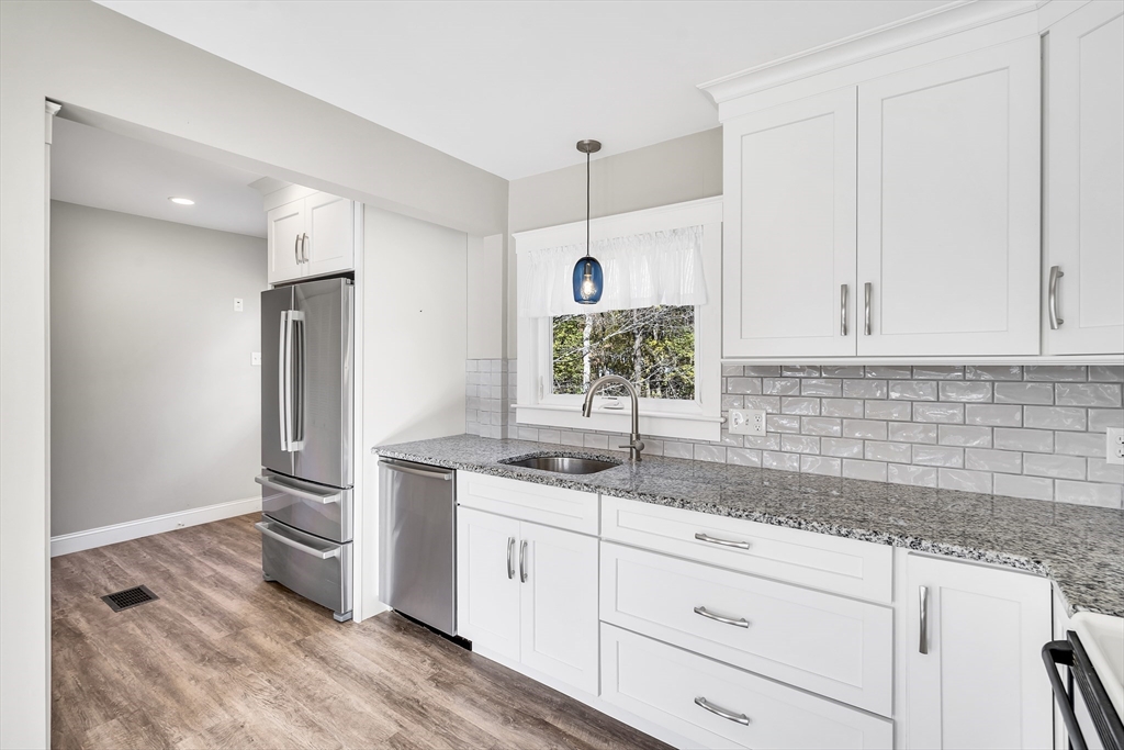 16 County Street Foxboro, MA 02035 - Photo 6 of 33 a kitchen with stainless steel appliances granite countertop a sink and a refrigerator