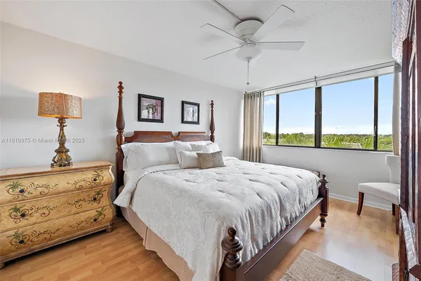 a bed room with a bed and a window