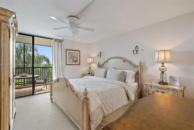 a bed room with a bed and a chandelier