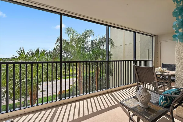 a view of a chairs and table in patio