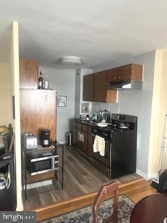 1200 South Arlington Ridge Road, Unit 415 Arlington, VA 22202 - Photo 11 of 16 a bedroom with a bed and chandelier