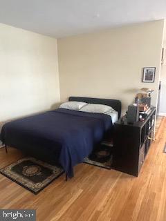 1200 South Arlington Ridge Road, Unit 415 Arlington, VA 22202 - Photo 4 of 16 a bed sitting in a bedroom next to a window