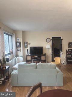1200 South Arlington Ridge Road, Unit 415 Arlington, VA 22202 - Photo 4 of 16 a living room with furniture and a flat screen tv