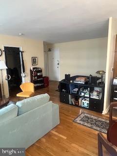 1200 South Arlington Ridge Road, Unit 415 Arlington, VA 22202 - Photo 5 of 16 a living room with furniture and a flat screen tv