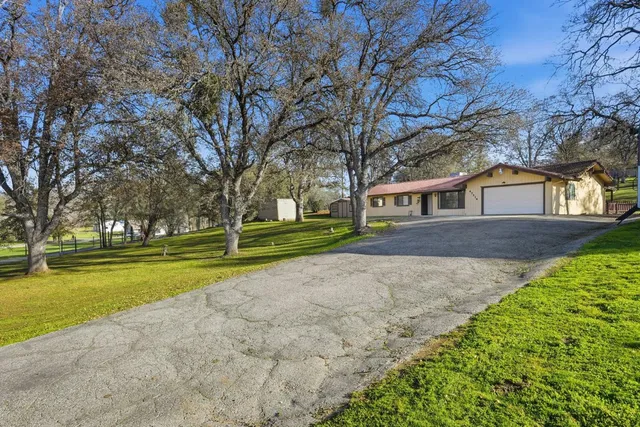 a view of house with outdoor space and street view