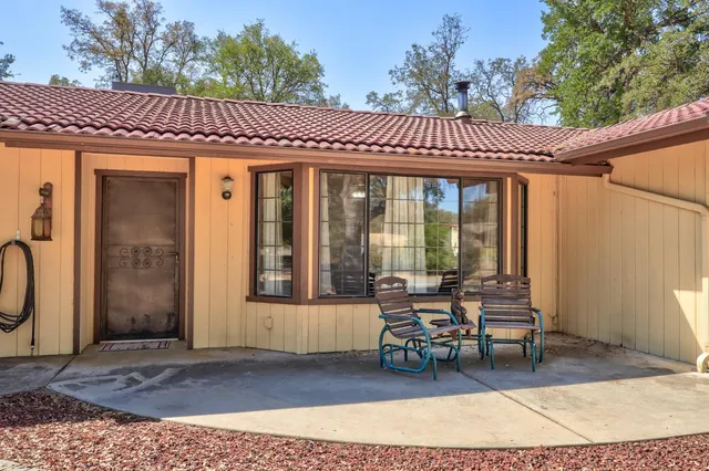 a patio with table and chairs