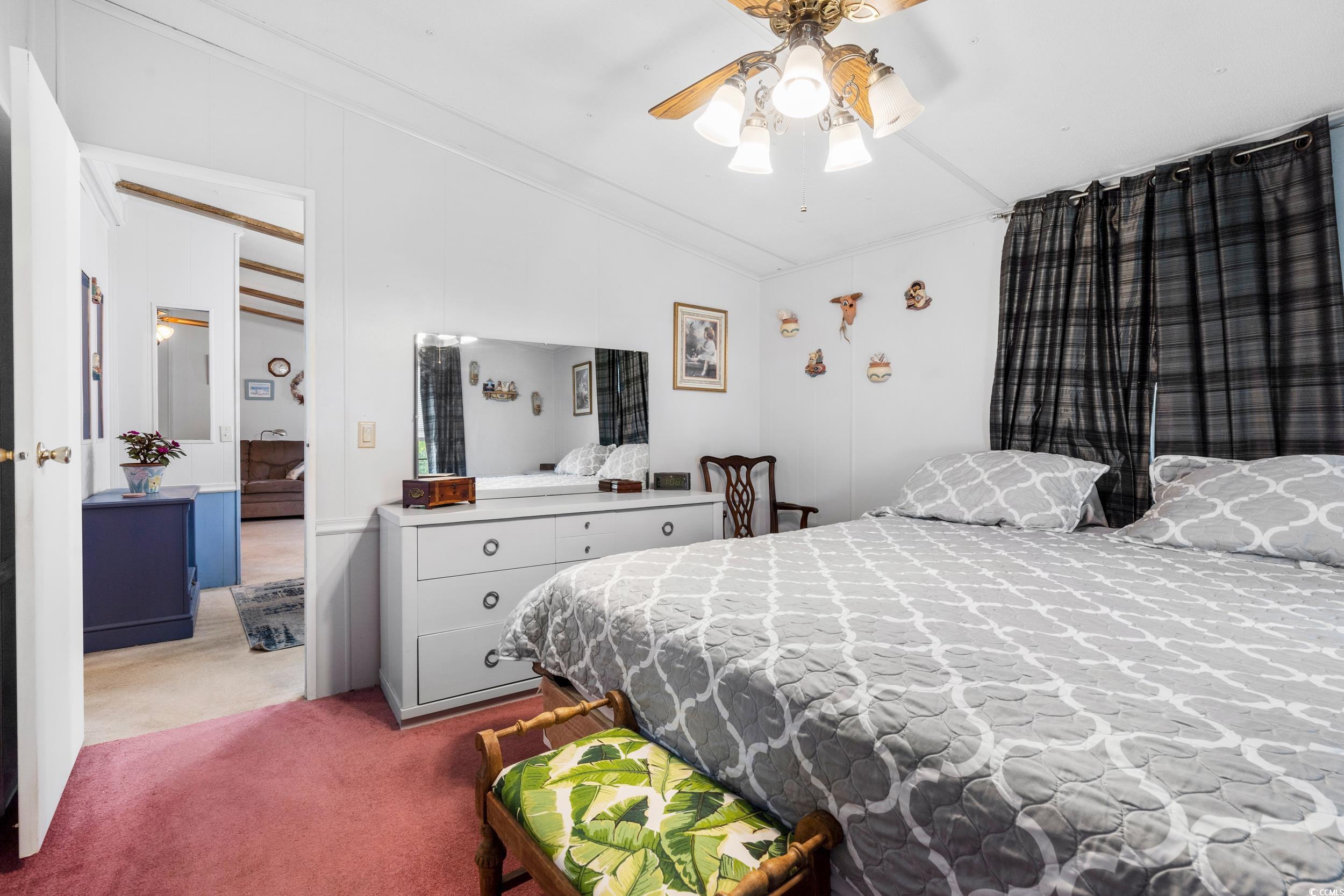 17 Crooked Island Circle Murrells Inlet, SC 29576 - Photo 16 of 39 Carpeted bedroom with lofted ceiling and ceiling fan