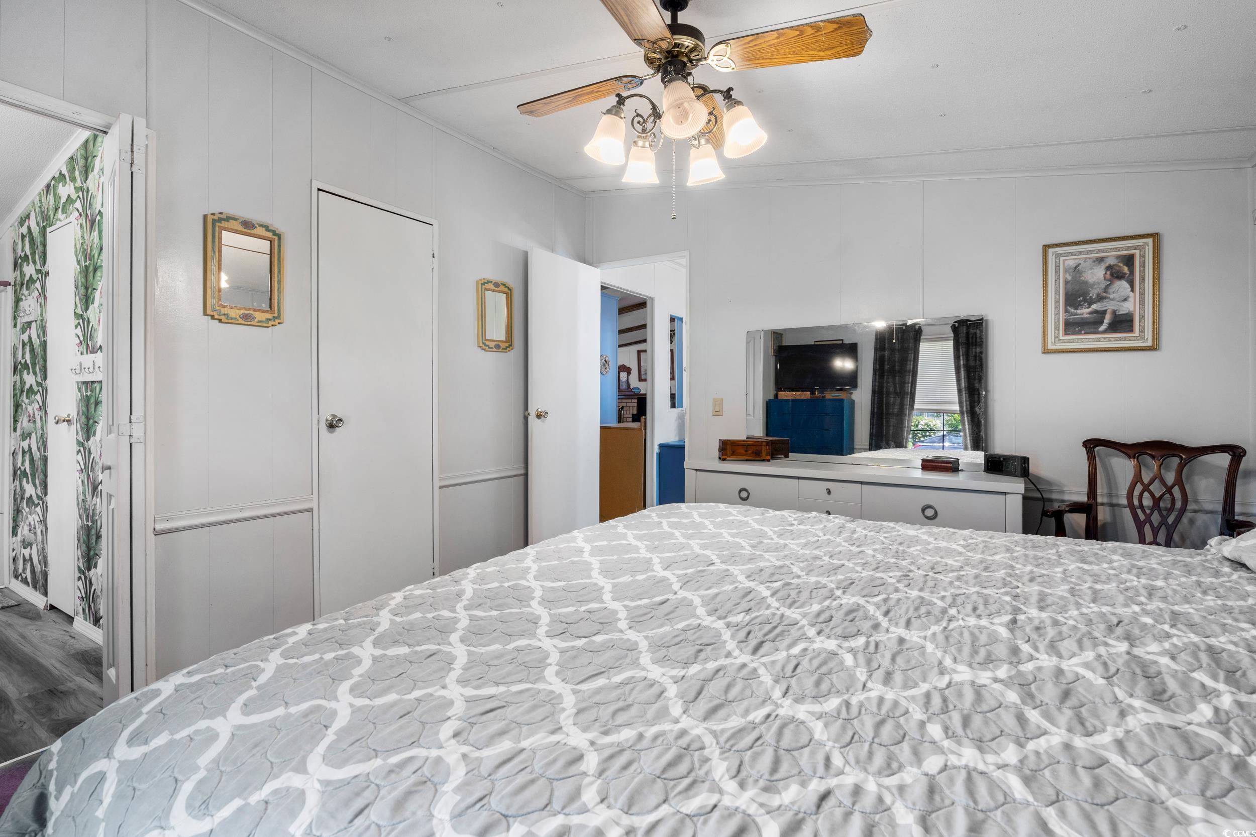 17 Crooked Island Circle Murrells Inlet, SC 29576 - Photo 17 of 39 Bedroom with ornamental molding, wood finished floors, and ceiling fan