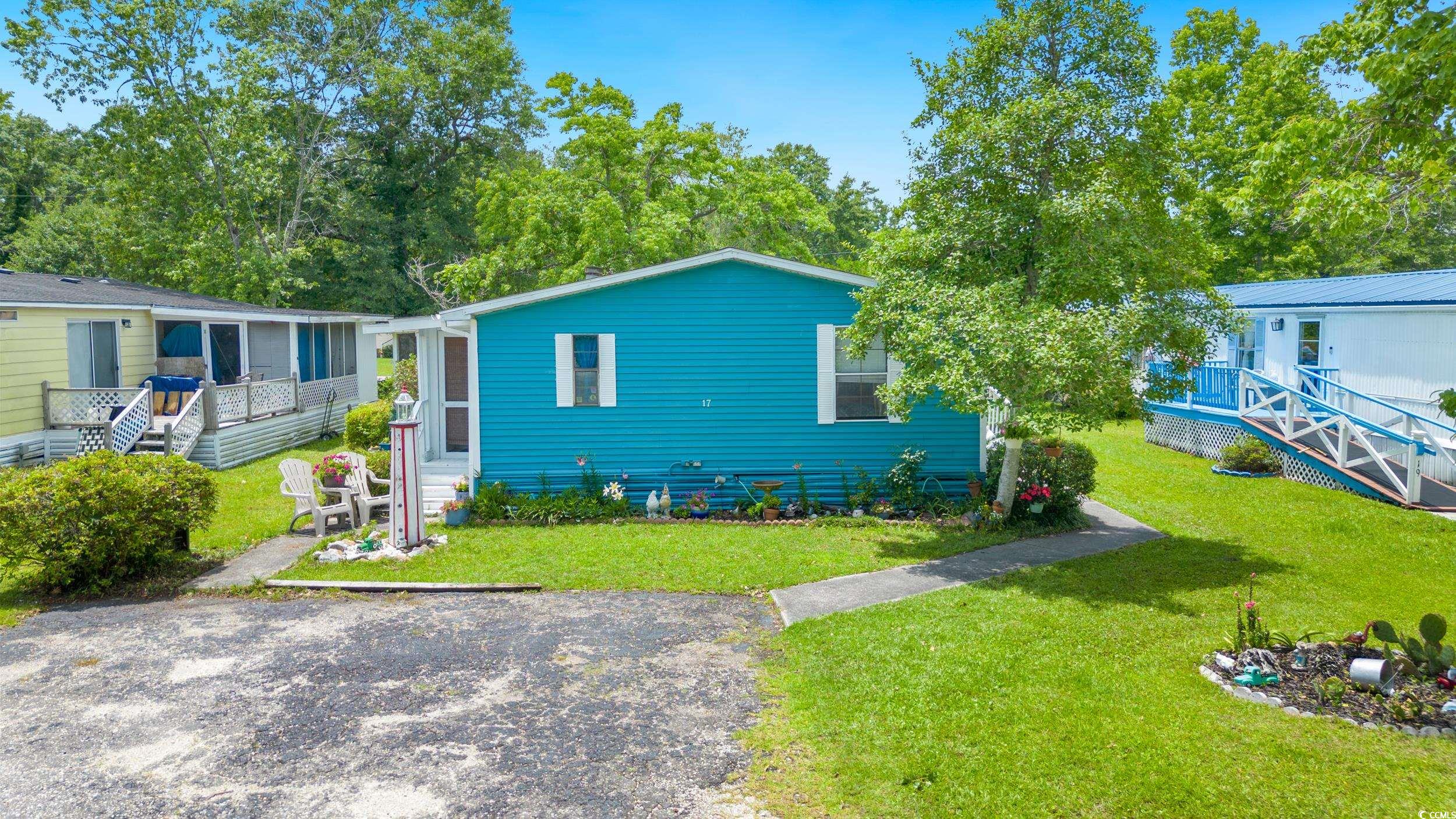 17 Crooked Island Circle Murrells Inlet, SC 29576 - Photo 2 of 39 View of front of house featuring a front lawn