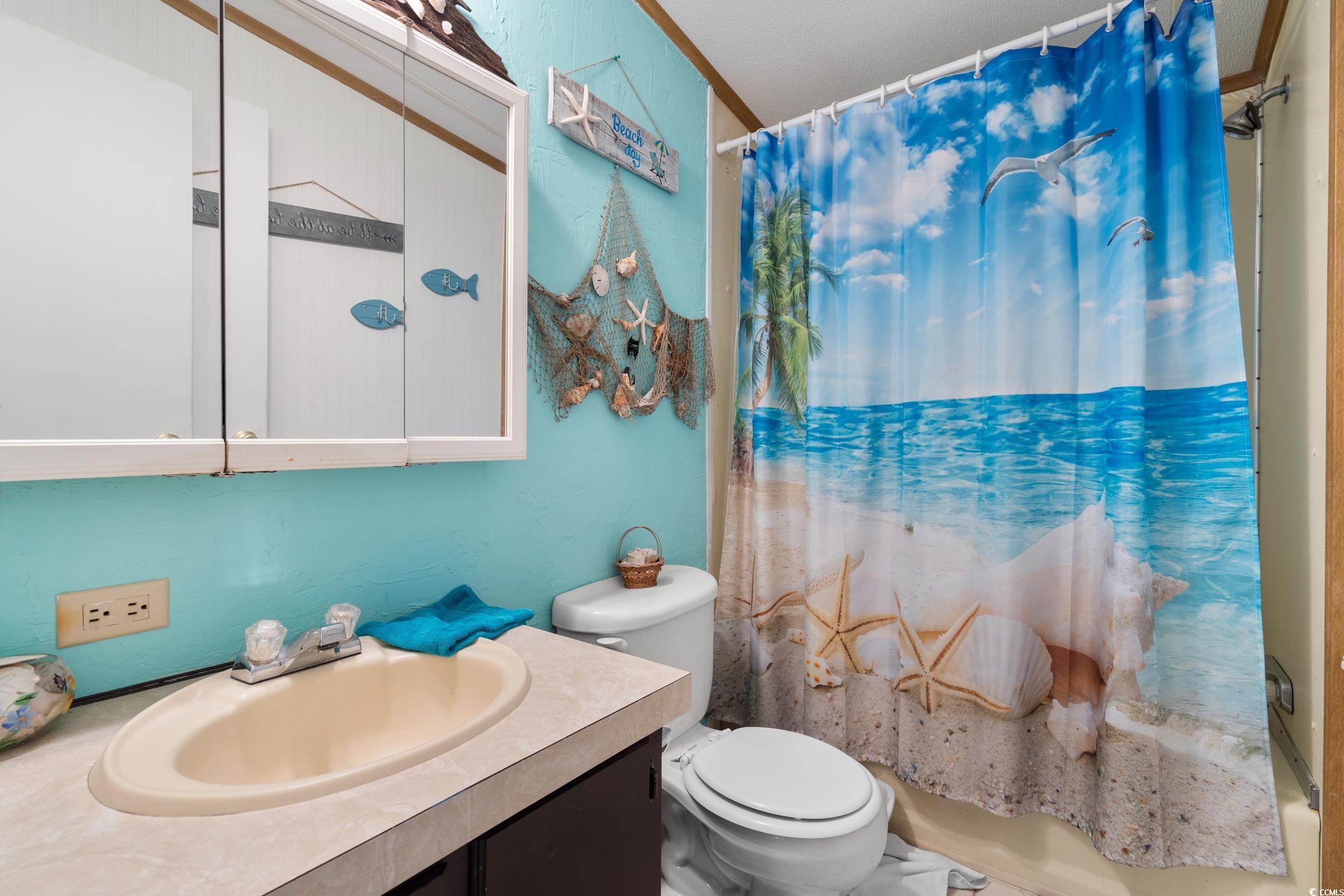 17 Crooked Island Circle Murrells Inlet, SC 29576 - Photo 22 of 39 Bathroom with toilet, vanity, and shower / tub combo