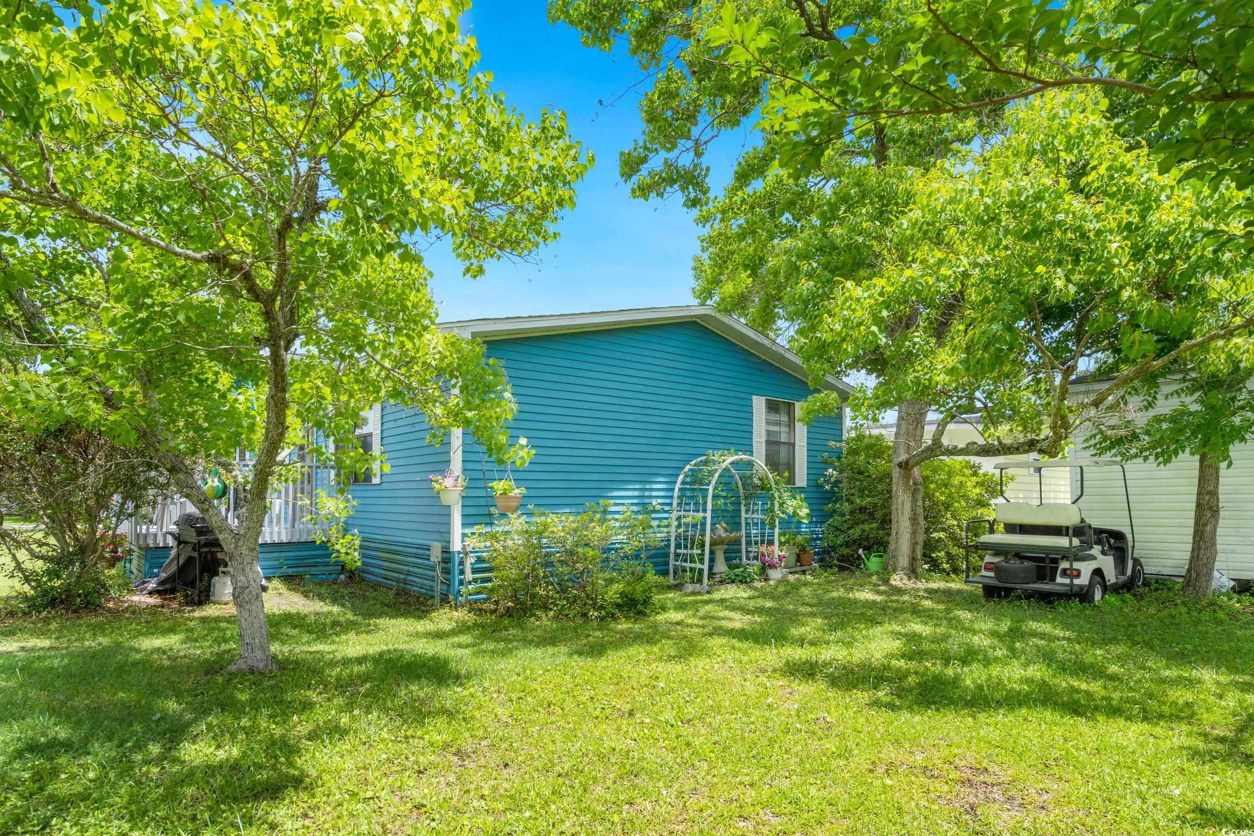 17 Crooked Island Circle Murrells Inlet, SC 29576 - Photo 30 of 39 View of home's exterior with a lawn