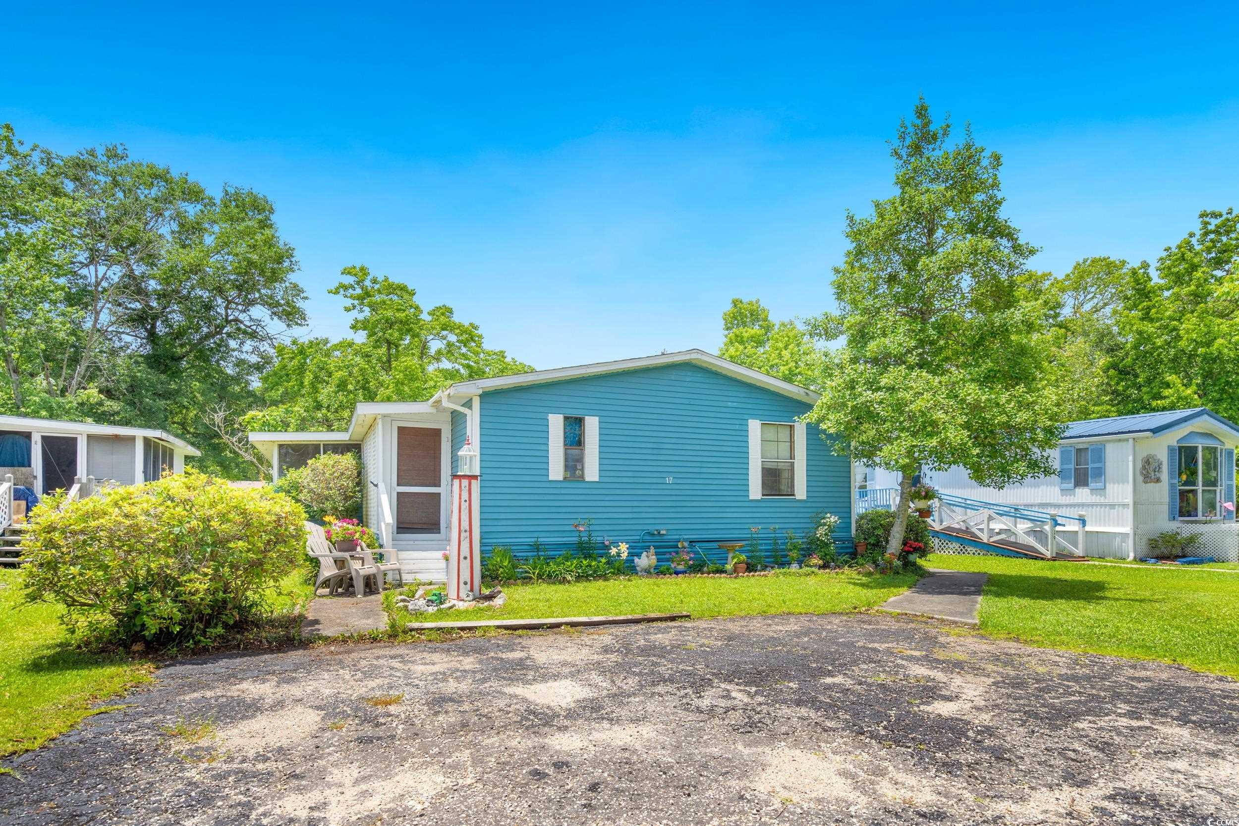 17 Crooked Island Circle Murrells Inlet, SC 29576 - Photo 3 of 39 View of front of house with a front lawn
