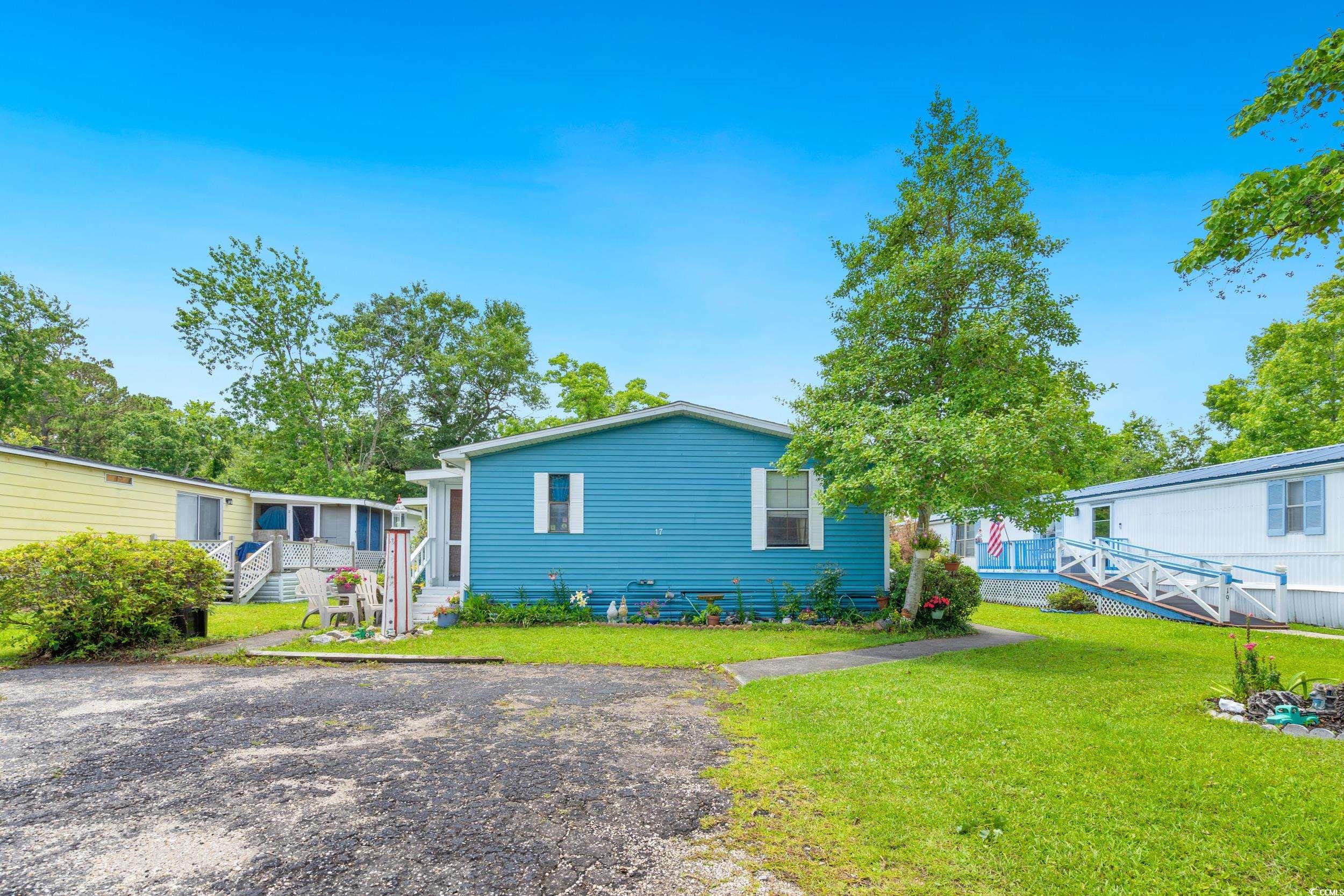 17 Crooked Island Circle Murrells Inlet, SC 29576 - Photo 31 of 39 View of front of property with a front yard and stairway