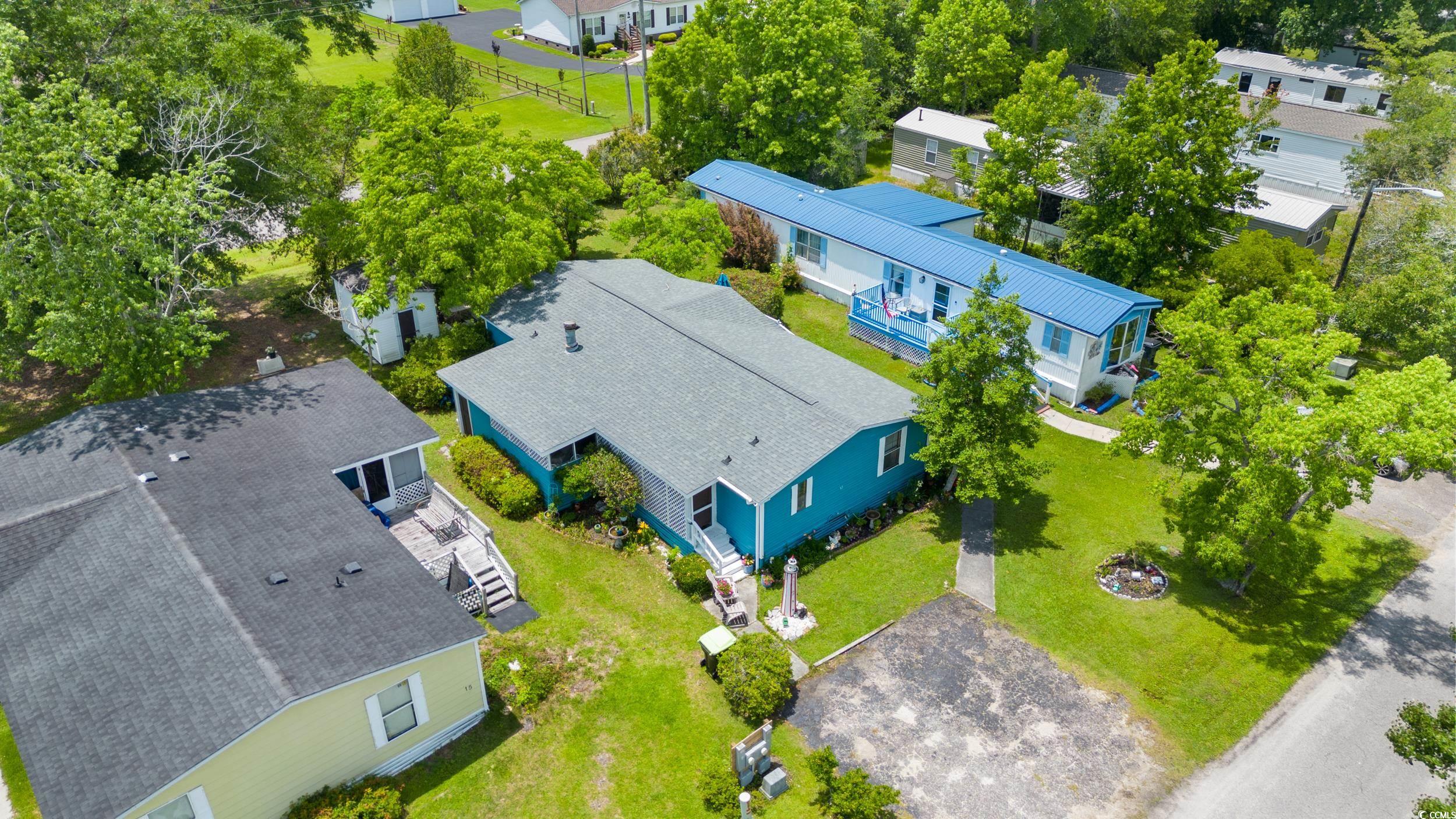 17 Crooked Island Circle Murrells Inlet, SC 29576 - Photo 33 of 39 View of subject property featuring a tree filled landscape