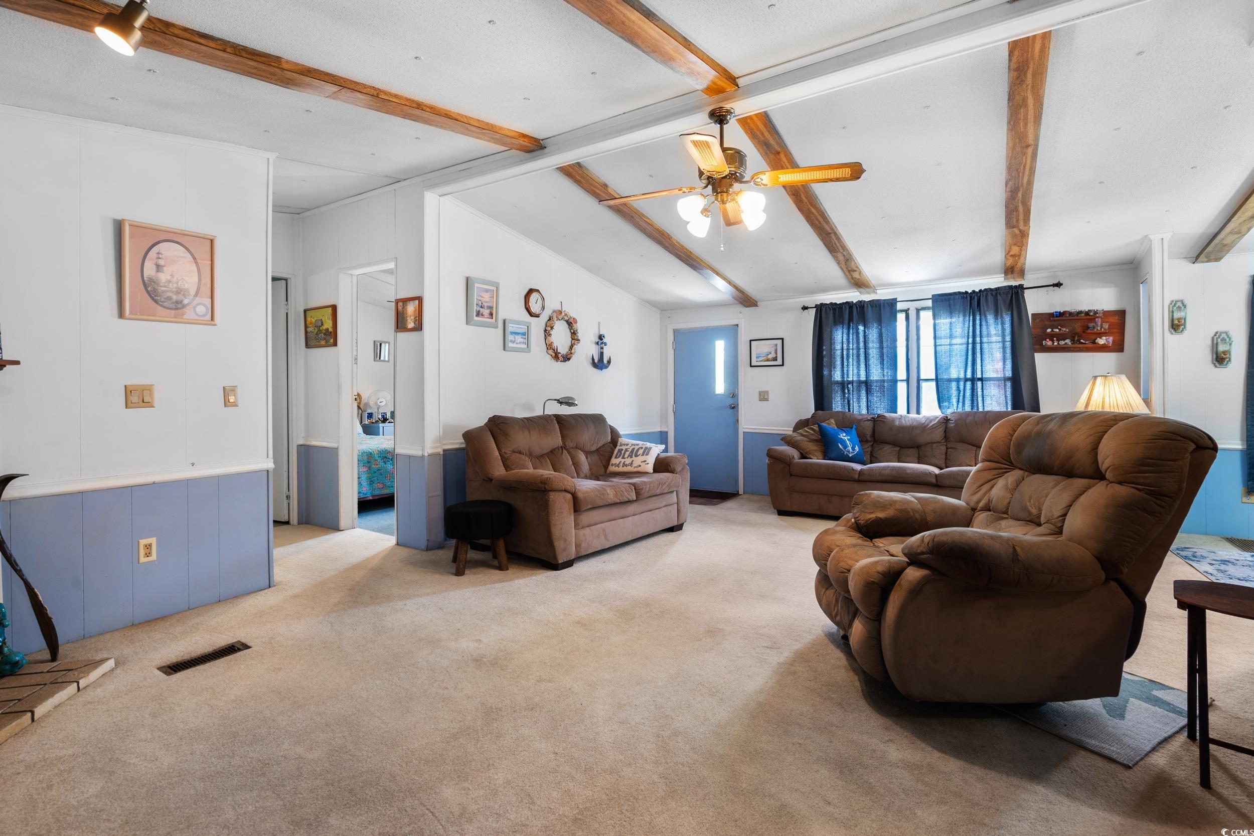 17 Crooked Island Circle Murrells Inlet, SC 29576 - Photo 7 of 39 Living area with light carpet and a ceiling fan