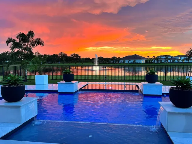 a view of a swimming pool with an outdoor space and seating area