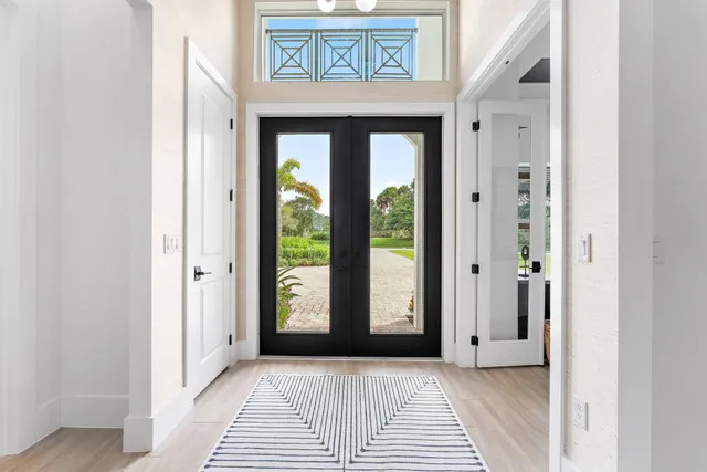 a living room with furniture a rug and a flat screen tv