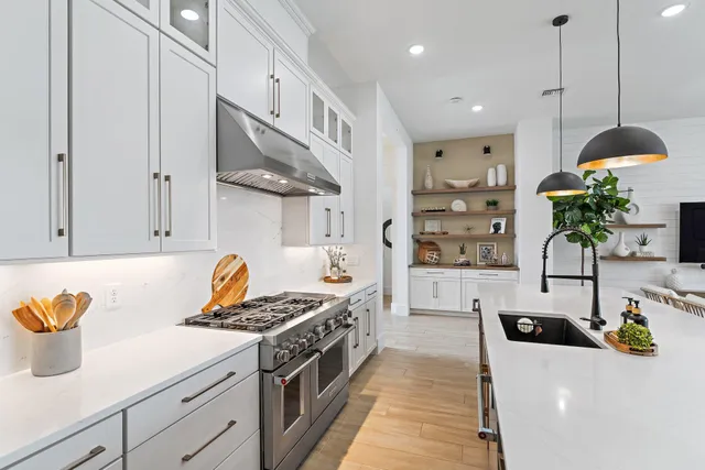 a view of swimming pool with outdoor seating and ocean view