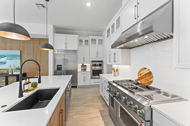a view of a house with swimming pool and sitting area