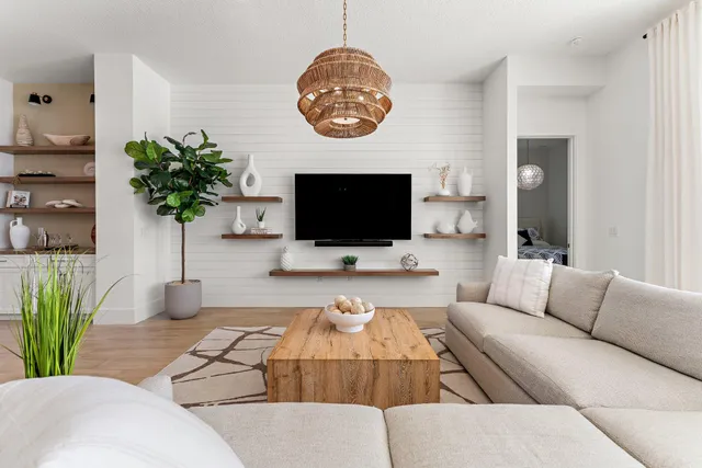 a kitchen with stainless steel appliances granite countertop a sink a stove and a wooden floors