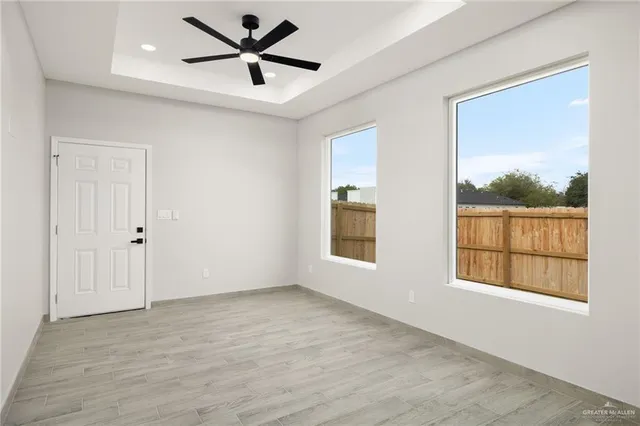 a view of an empty room with a window